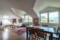 A seating area at I D'A Charming Penthouse - LAKE VIEW- Como- House-130 mt-2 double bedrooms and 2 double bathrooms a spacious living room-Full equipped kitchen-Private garden and terrace-Private covered parking