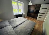 Posteľ alebo postele v izbe v ubytovaní Apartament Majka