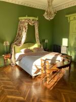 Łóżko lub łóżka w pokoju w obiekcie La Villa Romaine