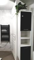 Telewizja i/lub zestaw kina domowego w obiekcie Jolie appartement avec 2 chambres partagées