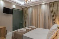 Posteľ alebo postele v izbe v ubytovaní AGORA luxury BOUTIQUE HOTEL