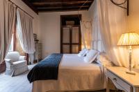 A bed or beds in a room at Isla Baja Suites
