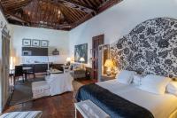 A bed or beds in a room at Isla Baja Suites