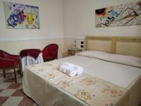 Hotel Trinacriaにあるベッド