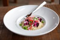 a white bowl of oatmeal with meat and peas at Los Cerros del Chaltén Boutique Hotel in El Chalten