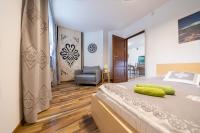 Posteľ alebo postele v izbe v ubytovaní Oliwkowy, Apartament widokowy z dużym tarasem