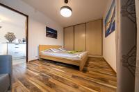 Posteľ alebo postele v izbe v ubytovaní Oliwkowy, Apartament widokowy z dużym tarasem