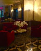 a room with a vase of flowers on a table at Hotel Amadeus in Venice