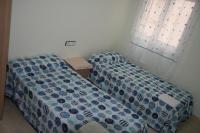 A bed or beds in a room at Apartament Franmar