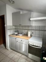 Kuchyňa alebo kuchynka v ubytovaní RETRO Apartments