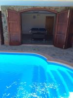 The swimming pool at or close to VILLA VITTORIA with PRIVATE HEATED SWIMMING POOL COMPLETE WITH HIDROMASSAGE FOR EXCLUSIVE USE , SEA VIEW, 150 METERS FROM THE BEACH