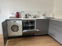 A kitchen or kitchenette at AT HOME COLOSSEO