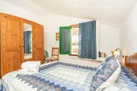 A bed or beds in a room at Casa Rural La Capellania