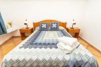 A bed or beds in a room at Casa Rural La Capellania