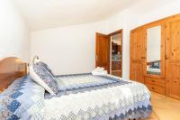 A bed or beds in a room at Casa Rural La Capellania