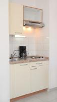 Kuchyňa alebo kuchynka v ubytovaní Apartment Vinjerac 3248c