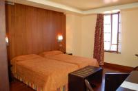 Postel nebo postele na pokoji v ubytování Hotel La Casona de Lupa