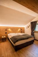Posteľ alebo postele v izbe v ubytovaní Pradella Apartments