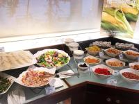 a buffet with many different dishes of food on a table at Airline Inn Green Park Way in Taichung