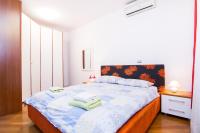 Posteľ alebo postele v izbe v ubytovaní Apartments City Wellness Center
