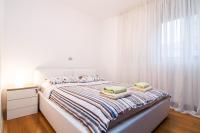 Posteľ alebo postele v izbe v ubytovaní Apartments City Wellness Center