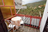 a table and chairs on the balcony of a house at Apartments with a parking space Podaca, Makarska - 4747 in Podaca