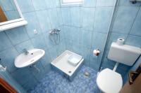 a blue bathroom with a sink and a toilet at Apartments with a parking space Podaca, Makarska - 4747 in Podaca
