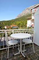 a white table and two chairs on a balcony at Apartments with a parking space Podaca, Makarska - 4747 in Podaca