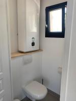 a small bathroom with a toilet and a window at Maison avec vue sur le massif de l Étoile in Marseille