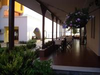 a patio with tables and chairs in a building at APARTMENT DELUXE MARINA CAPE 4 stars complex 33 6 in Aheloy