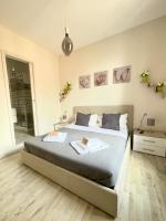 A bed or beds in a room at San Pietro Rooms 84