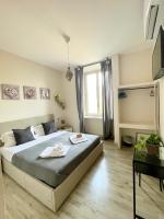 A bed or beds in a room at San Pietro Rooms 84
