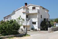 a large white building on the side of a road at Double Room Krk 5294b in Krk