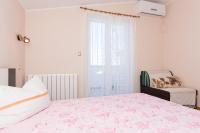 a bedroom with a large bed and a window at Double Room Krk 5294b in Krk