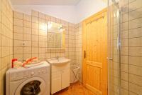 a bathroom with a washing machine and a sink at Apartments with a parking space Zupanje, Krk - 5307 in Županje