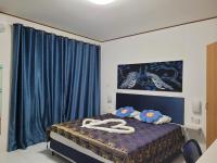 Postel nebo postele na pokoji v ubytování B&B NAMO PHUKET