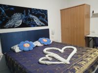 Postel nebo postele na pokoji v ubytování B&B NAMO PHUKET