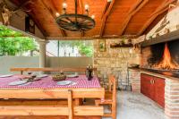 an outdoor table with a fireplace in a patio at Studio Nin 5666b in Nin