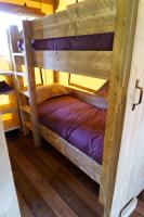 a couple of bunk beds in a room at LE LODGE DU DOMAINE in Saint-Hilaire-en-Morvan