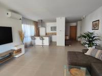 A television and/or entertainment centre at Garden Suites luxury apartment