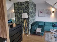 Posedenie v ubytovaní Zielony apartament z widokiem na jezioro