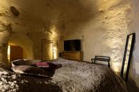 Televízia a/alebo spoločenská miestnosť v ubytovaní Grotta Barisano