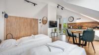 Posteľ alebo postele v izbe v ubytovaní Apartamenty Sun & Snow Baltic Sun z basenem i placem zabaw