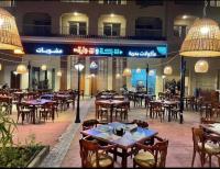 Restaurace v ubytování اكوا فيو الساحل الشمالى - vip studio