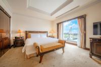 Lotte Hotel Saigonにあるベッド