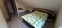 Posteľ alebo postele v izbe v ubytovaní Apartament Zacisze