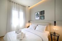 Posteľ alebo postele v izbe v ubytovaní Eos Residence