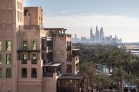 a view of a city with buildings and palm trees at Jumeirah Mina Al Salam Dubai in Dubai