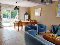 a dining room with a table and chairs at Chambres d&#39;hôtes chez l&#39;habitant - Bed&amp; Breakfast homestay in Huisnes-sur-Mer