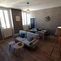a living room with a couch and a table at Halles Brauhauban Tarbes - T6 en collocation - Louez votre chambre in Tarbes